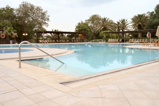 Swimming pool at sunrise in Amoudara in the north of Crete