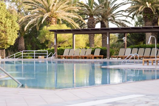 Swimming pool at sunrise in Amoudara in the north of Crete