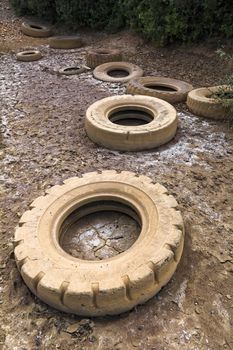 Abandoned car covers in the countryside create pollution.