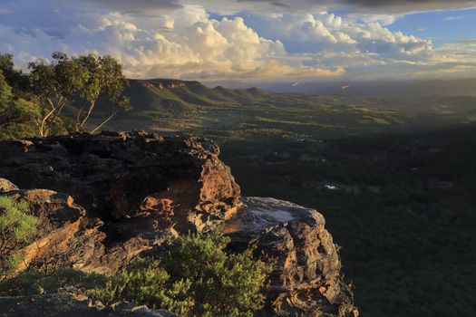 Magnificent views over the Megalong Valley from high up on th e cliffs of Blue Mountains.  Extraordinary clouds start to colour with the late afternoon sun as day drawers to a close.