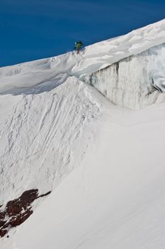 Snowboard freeride. Freerider jumping in the mountain