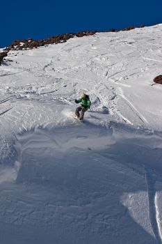 Snowboard freeride. Freerider on the slope of the mountain