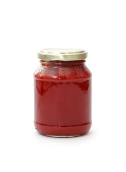 Glass jar with tomato paste isolated on white background. Clipping path is included