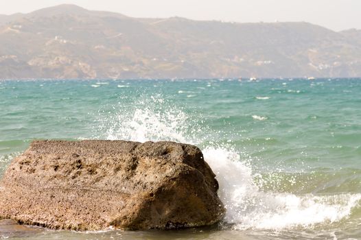 Wave crashing on a reef of the ocean on the island of Crete