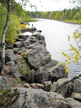 Beautiful small waterfall in a green deciduous forest