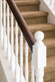 Abstract of Beautiful Stair Railing and Carpeted Steps in House.