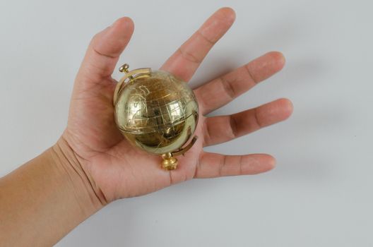 Golden Globe in hand isolated on white background