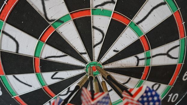 Business concept of darts. The target hanged on the wall.