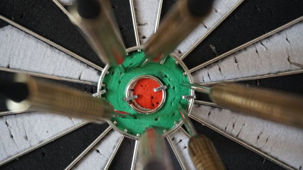 Business concept of darts. The target hanged on the wall.