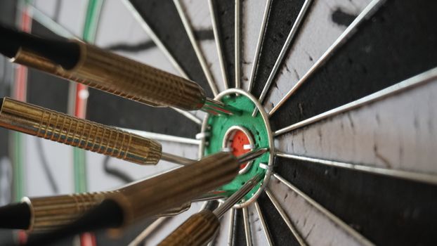 Business concept of darts. The target hanged on the wall.
