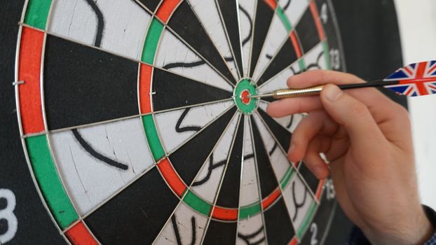 Business concept of darts. The target hanged on the wall.