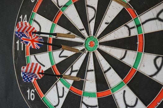 Business concept of darts. The target hanged on the wall.