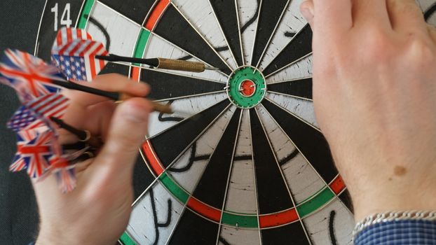 Business concept of darts. The target hanged on the wall.