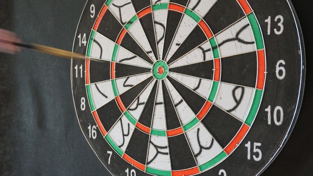 Business concept of darts. The target hanged on the wall.