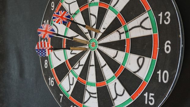 Business concept of darts. The target hanged on the wall.