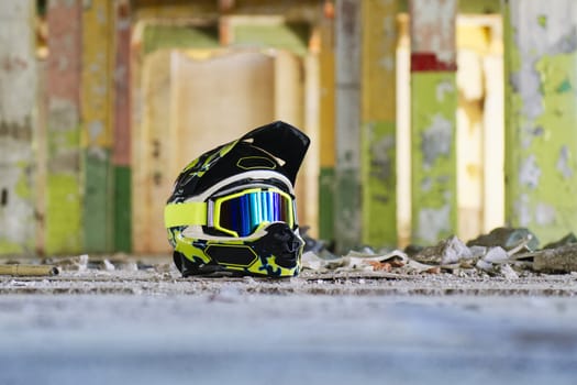 Motocross helmet on the floor in a old hall