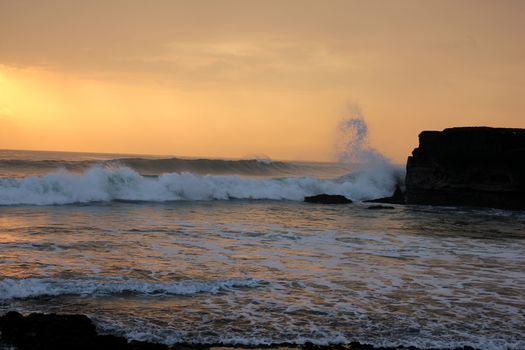 image with marine sunset and rock