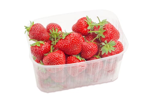 Ripe fresh strawberries in the transparent plastic container on a light background
