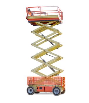 Mobile aerial work platform - red and yellow scissor hydraulic wheeled self propelled lift on a light background. 
