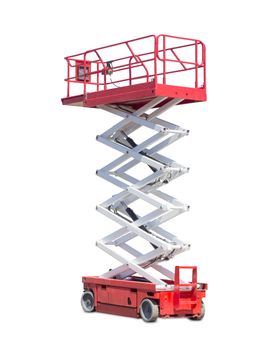 Mobile aerial work platform - red and white scissor hydraulic wheeled self propelled lift on a light background. 
