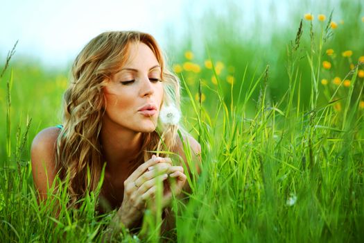 blonde lays and blow on dandelion