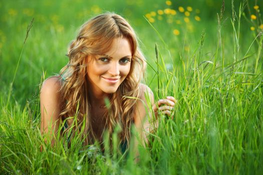 woman on the green grass happy and smile