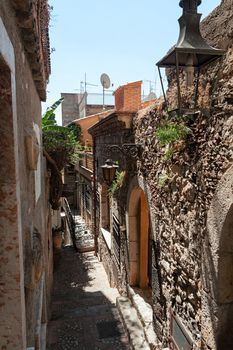 Typical ancient alley in Taormina, Sicily, Italy