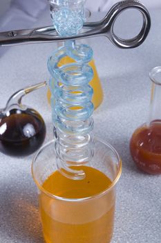 Liquids of different colors in laboratory containers