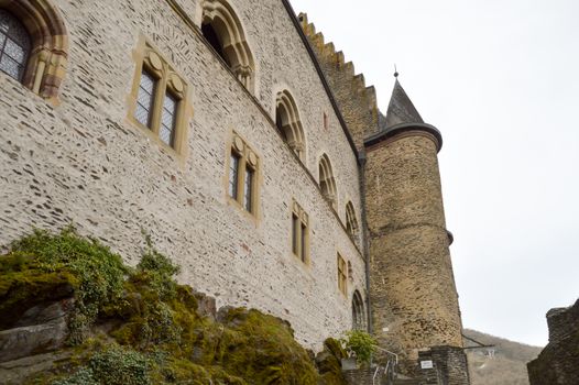 Part of the castle of Vianden with exterior walls and a tower