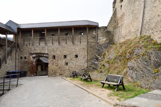 Entrance portico and inner courtyard of the castle of Vianden with exterior walls and a tower