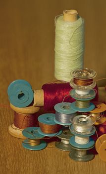 thread  on different sizes coil, bobbin, reel and spool