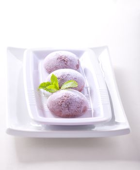 Chocolate coconut mochi ice cream on white background 