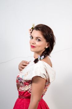 Portrait of a vintage girl with beautiful white floral dress.