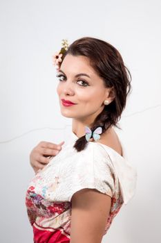 Portrait of a vintage girl with beautiful white floral dress.