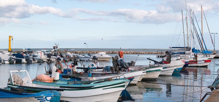 View of several traditional fishing boats on the port of Olhao, Portugal.
