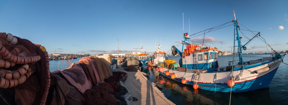 View of traditional fishing boats on the port of Olhao, Portugal.