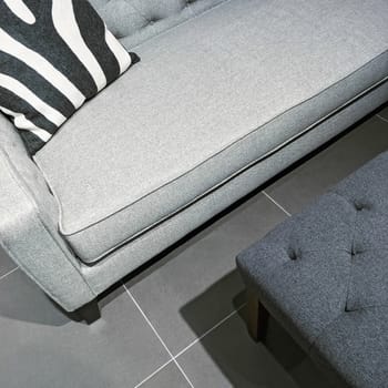 Detail of a living room in gray tones. Contemporary furniture.