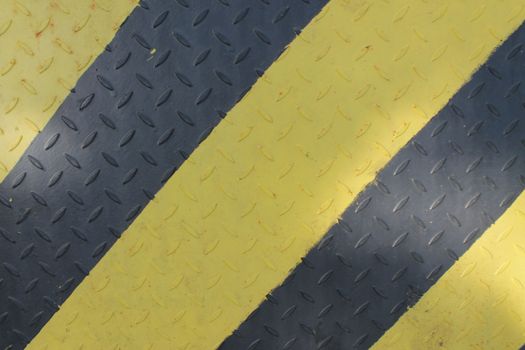 Black and yellow danger warning sign. Attention background