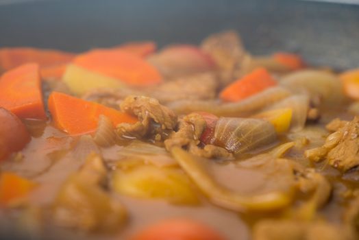 Japanese curry with smoke in the cooking pan