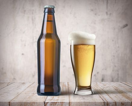 beer bottle and mug of beer on the bar