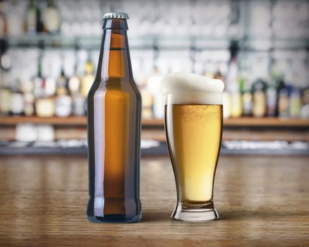 beer bottle and mug of beer on the bar