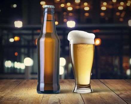 beer bottle and mug of beer on the bar