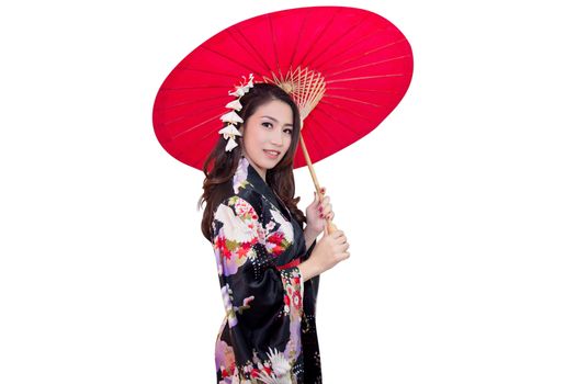 Beautiful young asian woman wearing traditional japanese kimono with red umbrella isolated on white background.