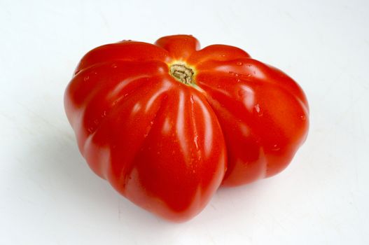 Red tomato of the big size of a grade of "Puzata Hata"