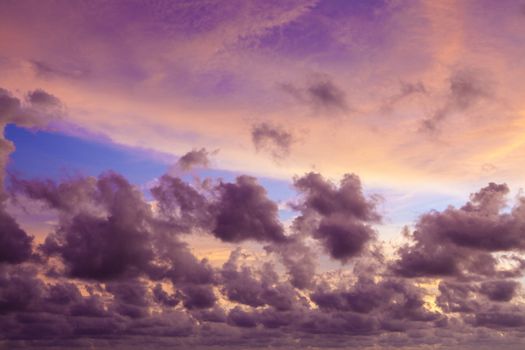 Sunset and dark clouds. Gray cloud before rain. Spring evening