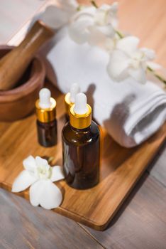 Spa still life with towel, white orchid, bath oil