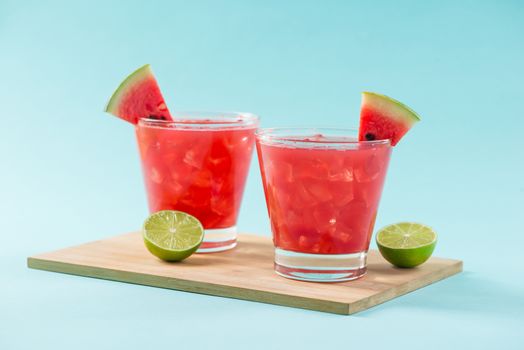 Watermelon drink in glasses with slices of watermelon in summertime