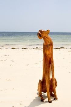 Wooden leopard on the beach of Bamburi near Mombasa in Kenya