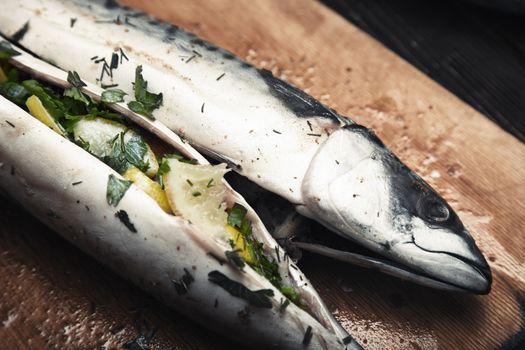 Fish stuffed by lemon and herbs with pepper