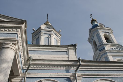 Ordinary church with gilding. Urban architecture in a provincial town.